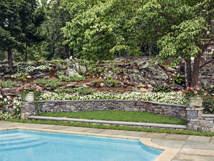 pool with stone wall added after