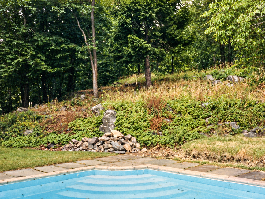 pool with stone wall added before